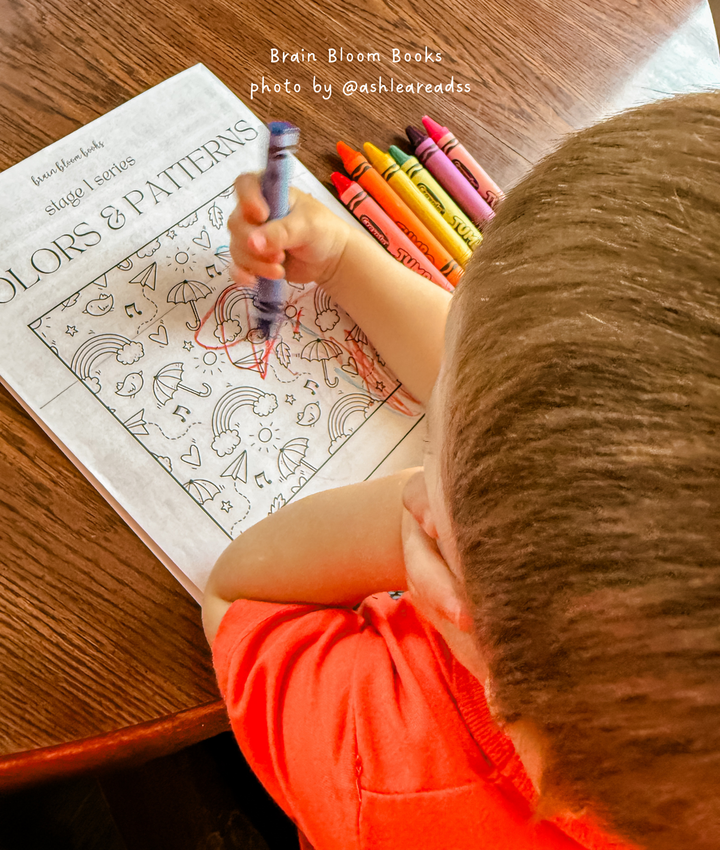 Close-up of elementary-aged child coloring in our Colors & Patterns activity book. Photo provided by affiliate customer.
