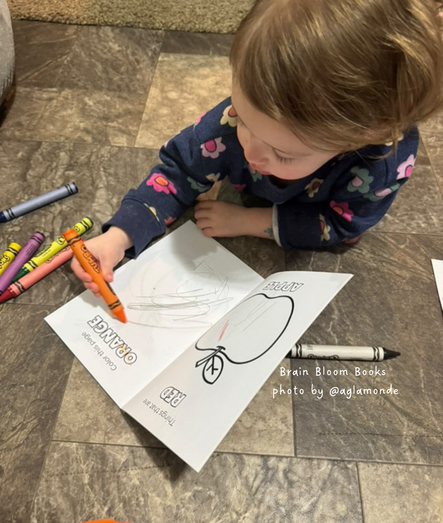 Close-up of elementary-aged child coloring in our Colors & Patterns activity book. Photo provided by affiliate customer.