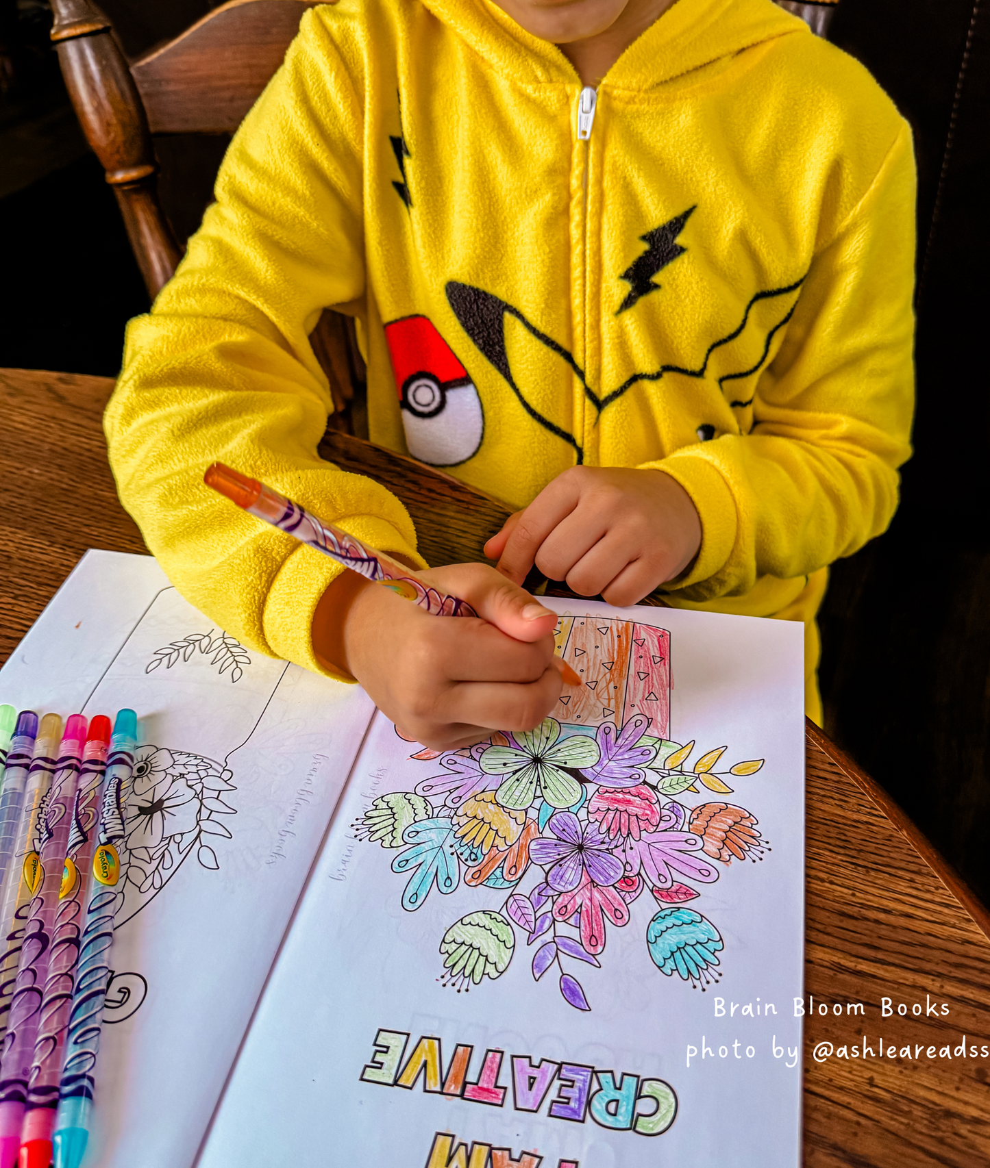 Close-up of elementary-aged child coloring in our Affirmations SEL activity book. Photo provided by affiliate customer.